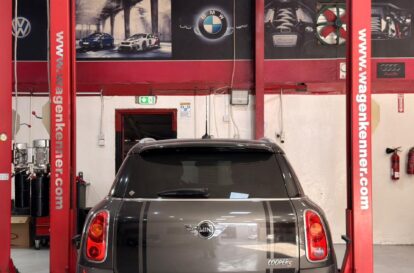 Mini Cooper rear view on lift at WagenKenner Dubai workshop – European car service and repair