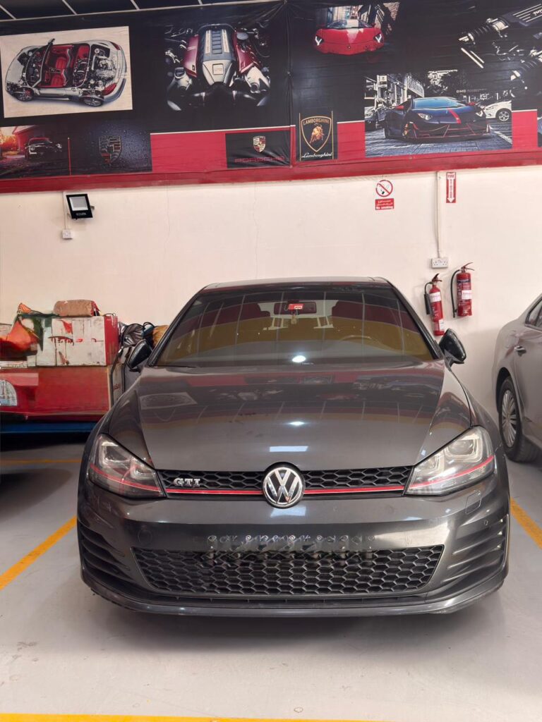 Volkswagen GTI front view inside WagenKenner Dubai workshop during service inspection