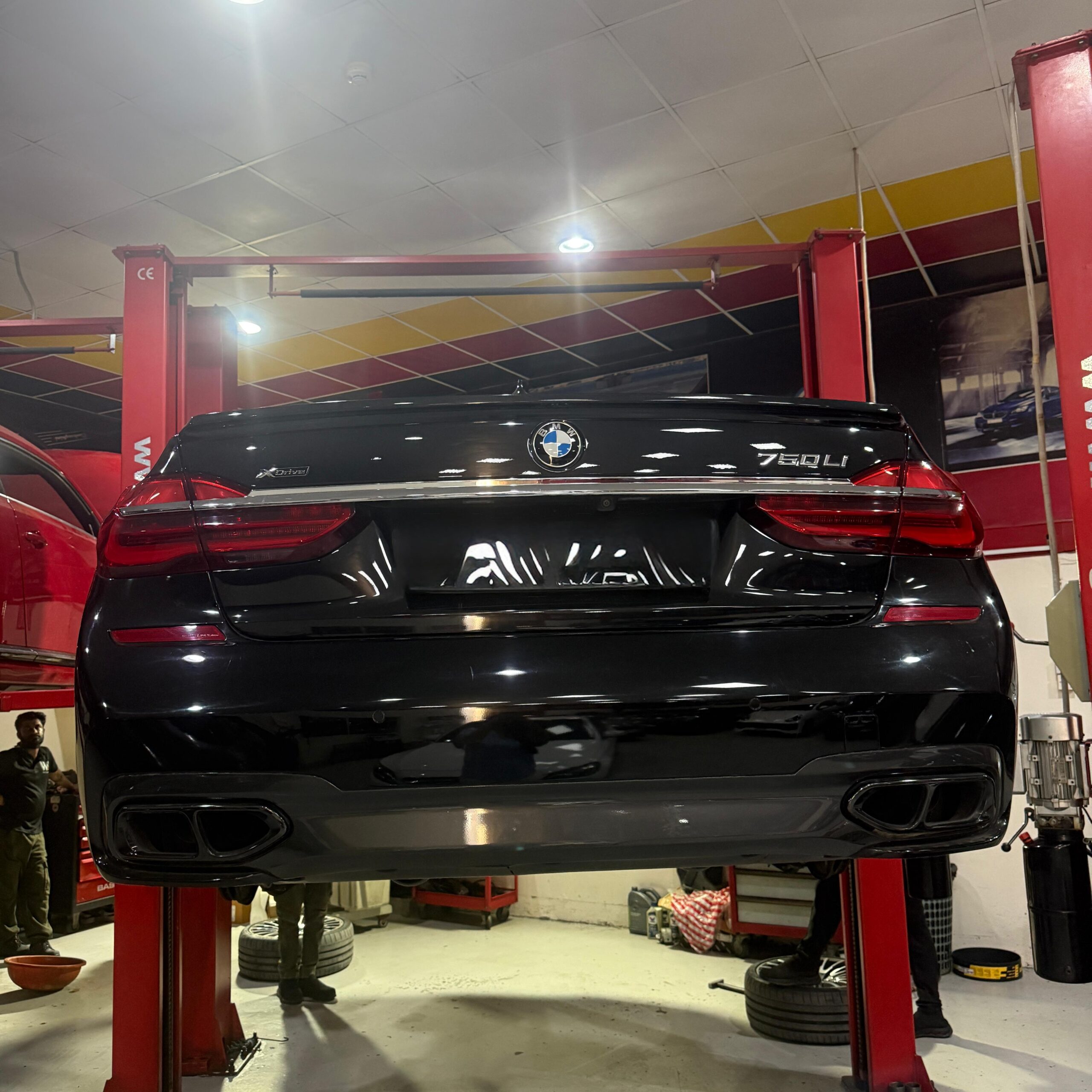 BMW on a lift for steering system inspection at WagenKenner in Al Quoz 4, Dubai