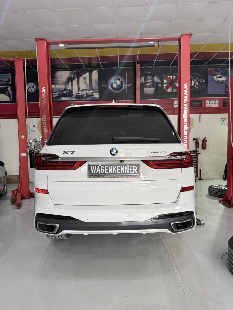 Rear view of a white BMW X7 at WagenKenner workshop in Al Quoz 4, Dubai