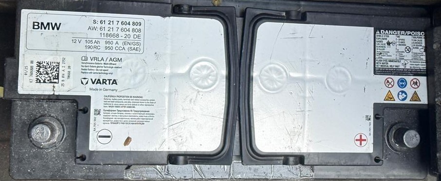 BMW-branded 12V 105Ah AGM battery with specification label visible